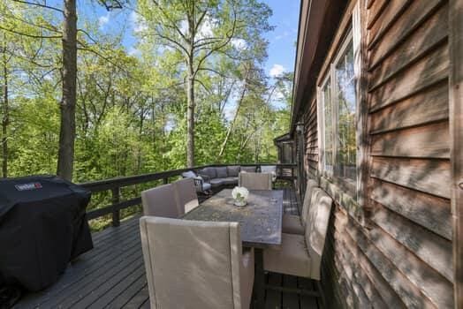 wooden terrace featuring area for grilling