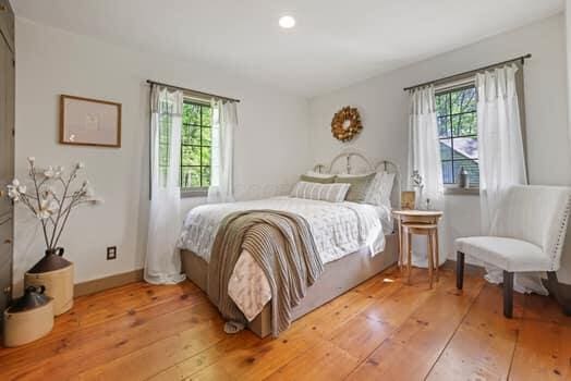 bedroom with hardwood / wood-style floors