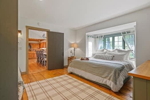 bedroom with wood-type flooring