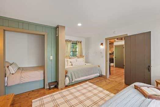 bedroom featuring wood-type flooring