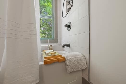 bathroom featuring walk in shower