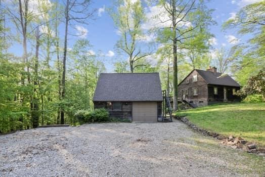 exterior space with a lawn and a garage