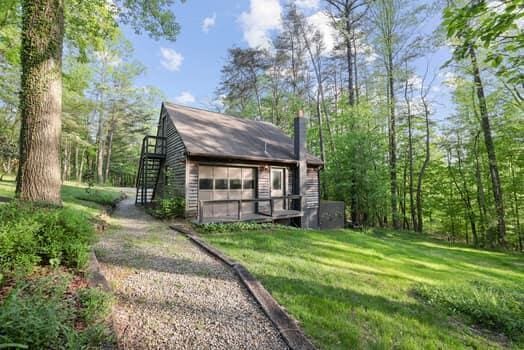 view of outbuilding featuring a yard