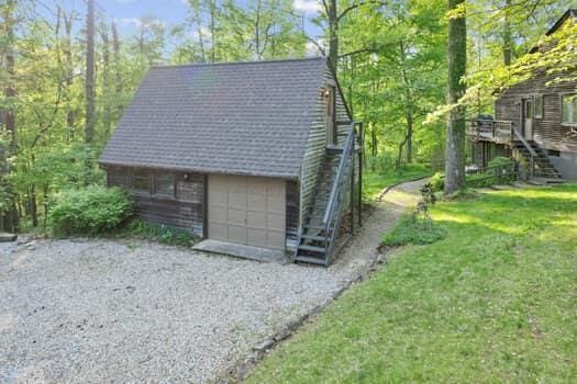 view of outbuilding featuring a yard and a garage