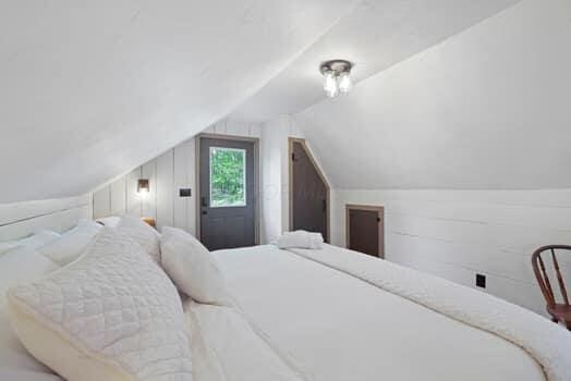 bedroom with lofted ceiling