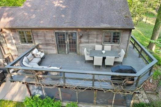 wooden terrace with an outdoor hangout area