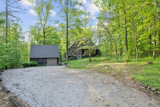 exterior space with an outbuilding and a garage