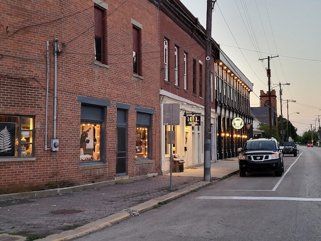 view of outdoor building at dusk