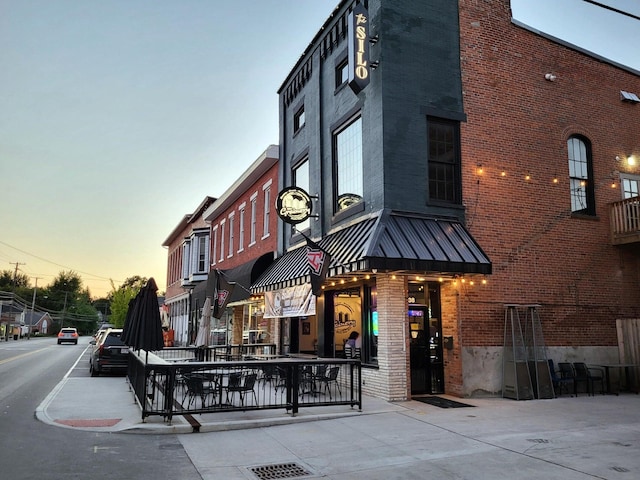 view of outdoor building at dusk