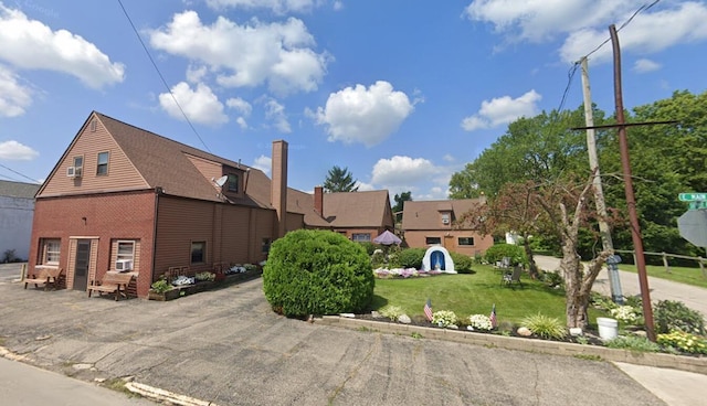 view of side of property with a yard