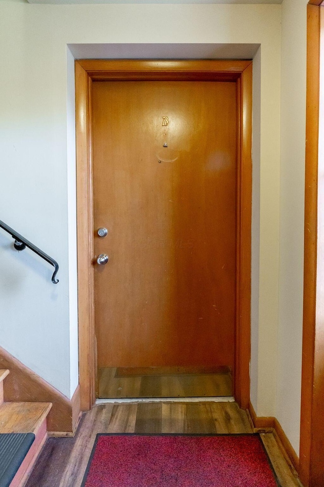 entryway with dark wood-type flooring