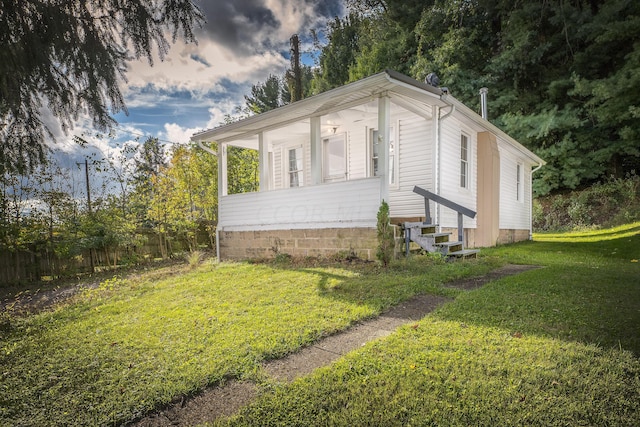 view of home's exterior with a yard