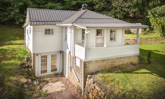 view of property exterior with a yard