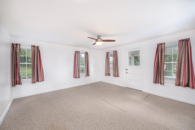 empty room with carpet and ceiling fan