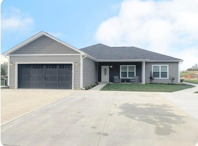 ranch-style house with a front yard and a garage