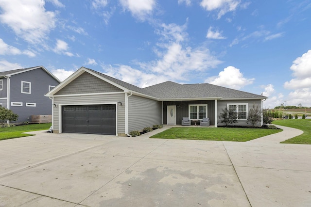 ranch-style home featuring a garage and a front yard