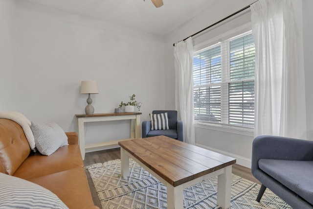 sitting room featuring ceiling fan and hardwood / wood-style floors