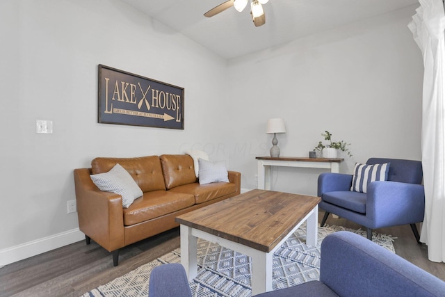 living room with dark hardwood / wood-style floors and ceiling fan