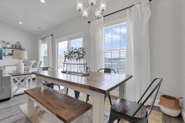 dining room featuring a chandelier and light wood-type flooring