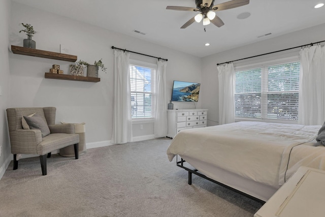 bedroom featuring ceiling fan and light colored carpet