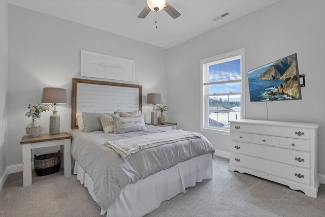 bedroom with light carpet and ceiling fan