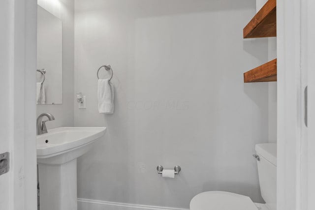 bathroom with toilet and sink