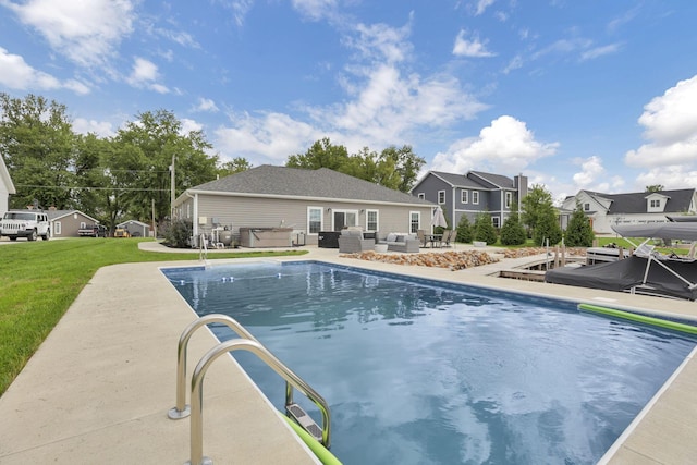 view of swimming pool featuring a lawn, outdoor lounge area, and a patio