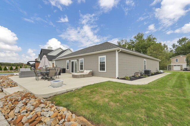 back of property featuring a lawn, cooling unit, an outdoor hangout area, and a patio