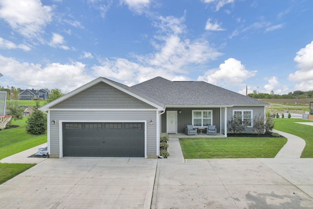 ranch-style home featuring a garage and a front yard