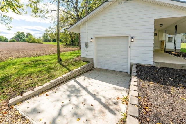 garage with a lawn