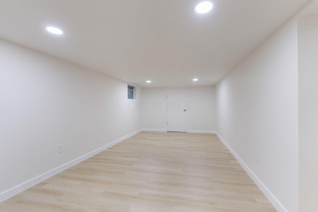 basement featuring light wood-type flooring