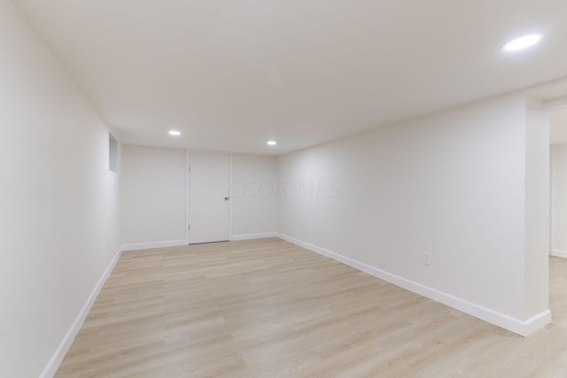 spare room featuring light wood-type flooring