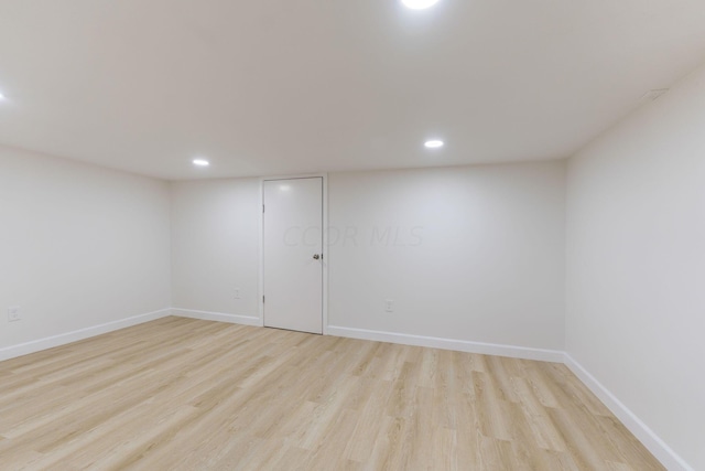 spare room featuring light hardwood / wood-style floors