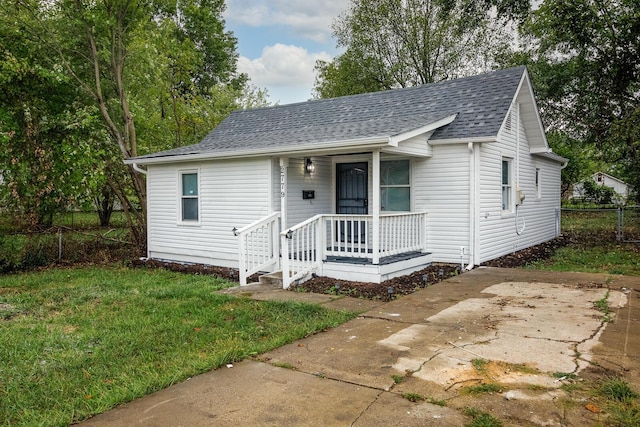 bungalow-style home featuring a front yard