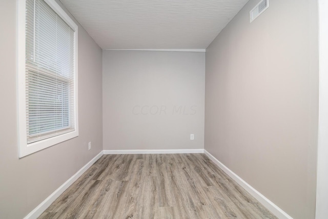 spare room with light wood-type flooring