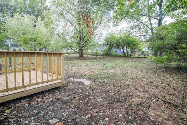 view of yard with a wooden deck