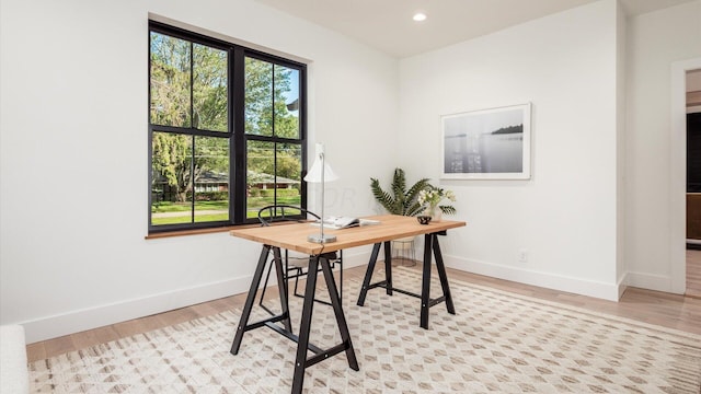 office area with light wood-type flooring