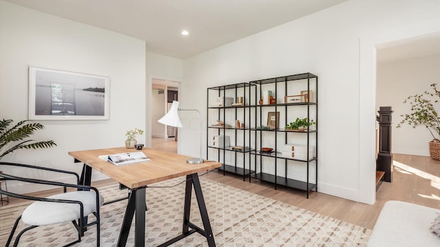 office space with light wood-type flooring