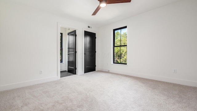 unfurnished bedroom featuring ceiling fan and carpet floors