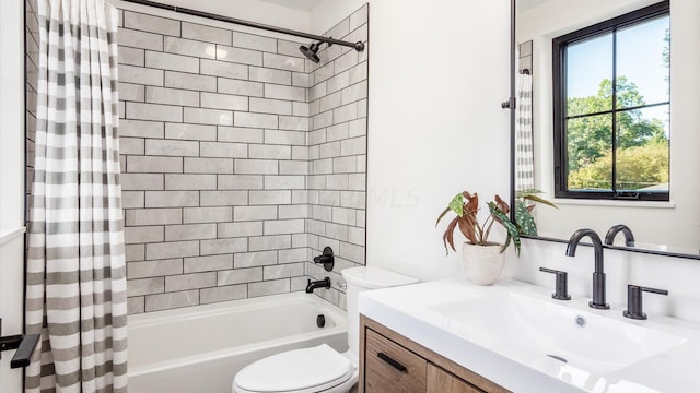 full bathroom featuring vanity, toilet, and shower / tub combo with curtain