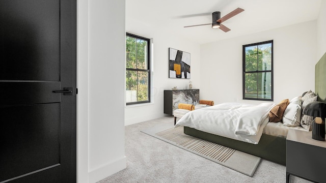 bedroom featuring ceiling fan and light colored carpet