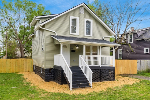 view of front of property with a front lawn and a porch