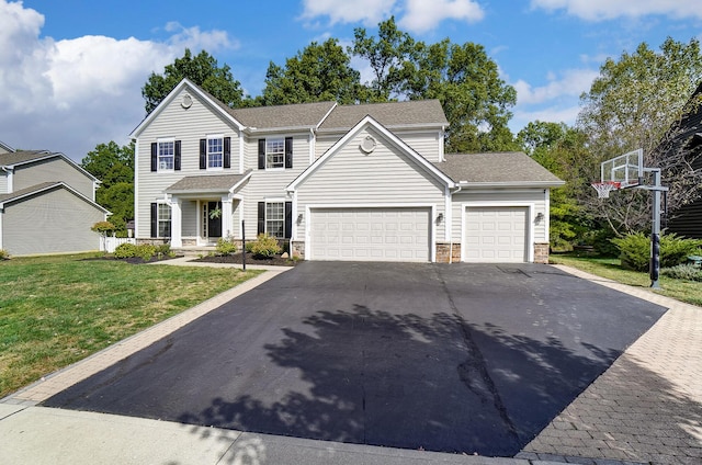 view of front facade with a front lawn and a garage