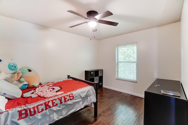 bedroom featuring dark hardwood / wood-style floors and ceiling fan