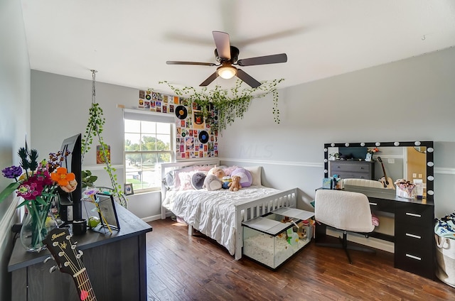 bedroom featuring ceiling fan and dark hardwood / wood-style flooring