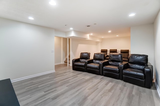 cinema featuring light hardwood / wood-style floors