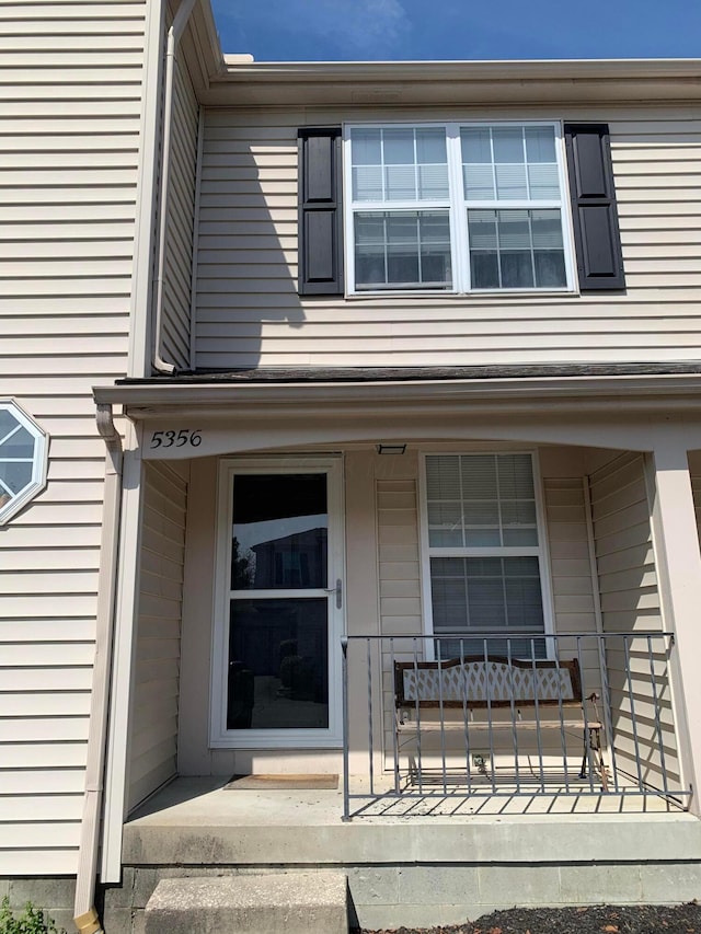 property entrance featuring covered porch