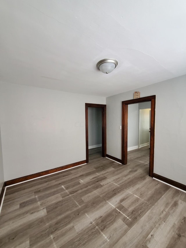 empty room featuring wood-type flooring