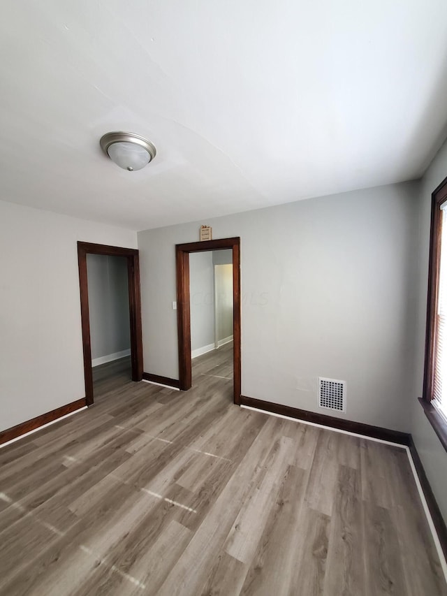 empty room with light wood-type flooring