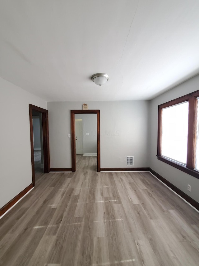 empty room featuring light hardwood / wood-style floors